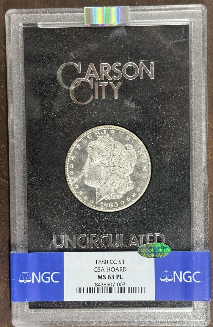 1880 Carson City Morgan Dollar NGC MS63PL CAC Box COA: 1880 Carson City Morgan Dollar NGC MS63PL CAC Box COA This is an 1880-CC Morgan Silver Dollar graded MS63PL by NGC. The coin is uncirculated and features a prooflike finish. It was minted in Carson Ci