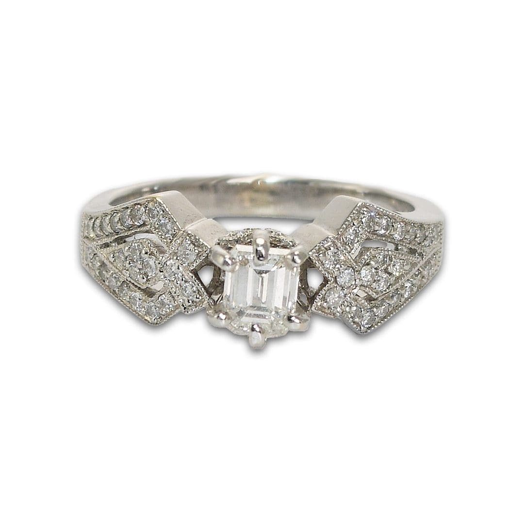 Emerald Cut Diamond Solitaire Ring 18k White Gold Size 7.25: Emerald Cut Diamond Solitaire Ring 18k White Gold Size 7.25 This elegant engagement ring features a center emerald cut natural diamond weighing 0.50 carats, graded G color and VS2 clarity, with a very