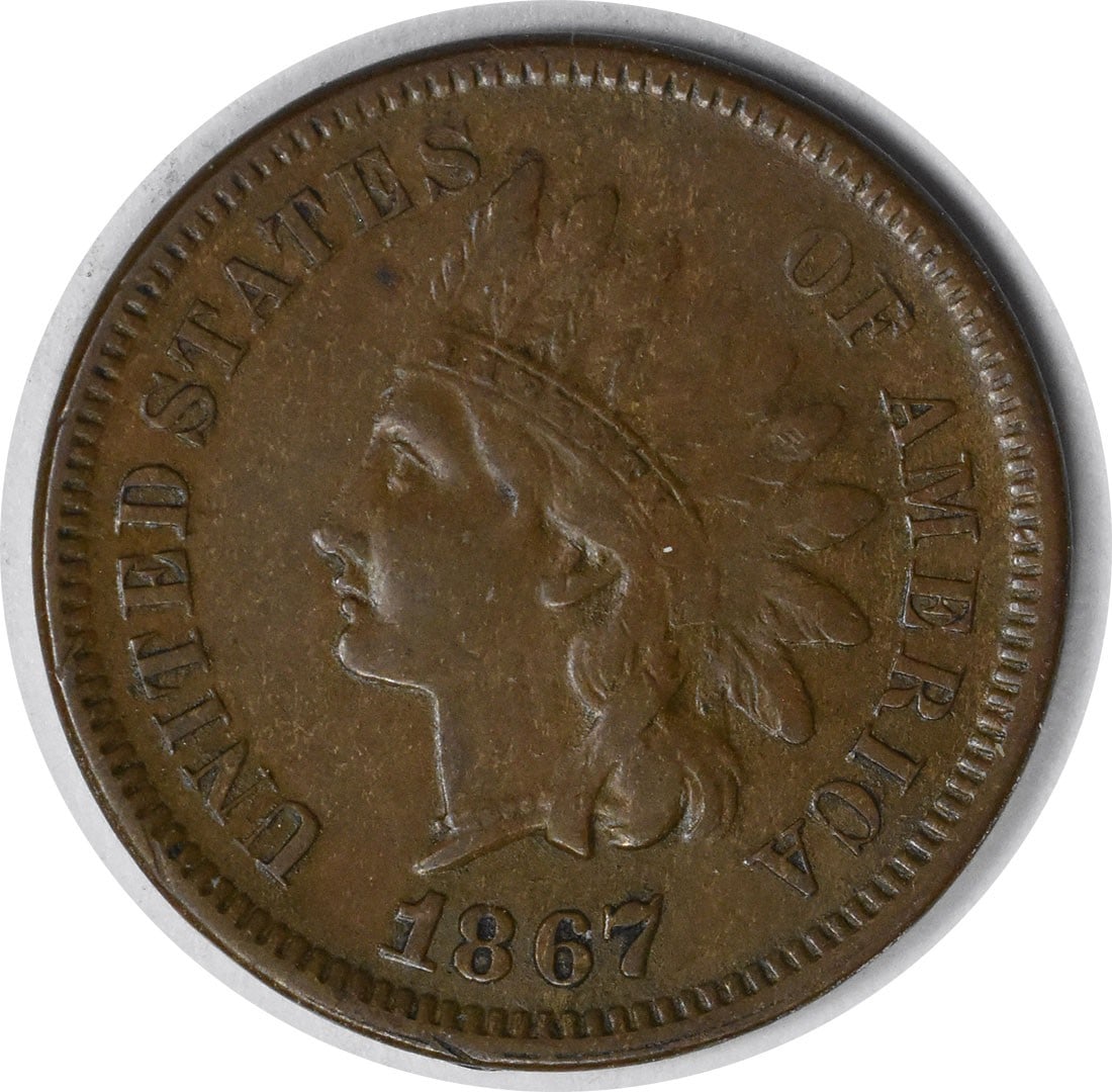 1867 Indian Head Copper Small Cent EF Uncertified: 1867 Indian Head Copper Small Cent EF Uncertified This 1867 Indian Head Cent is an uncirculated, pre-owned coin featuring the classic Native American headdress design. Struck in copper, it is graded E