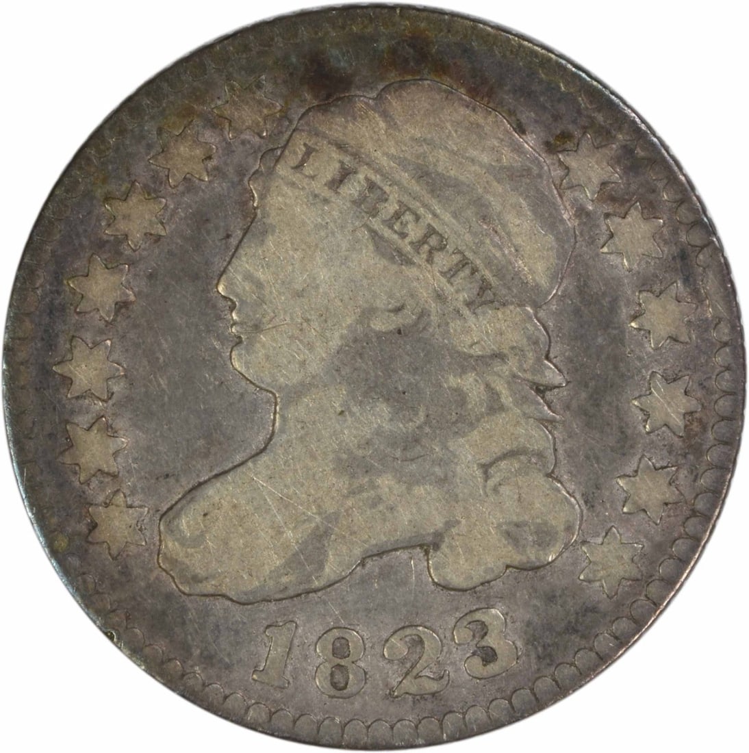 Capped Bust 1823 Over 2 Dime Philadelphia G Grade Uncertified Silver Coin: Capped Bust 1823 Over 2 Dime Philadelphia G Grade Uncertified Silver Coin This 1823/2 Capped Bust Dime is a circulated coin featuring the small 'Es' variety. Minted in Philadelphia, it is composed of 
