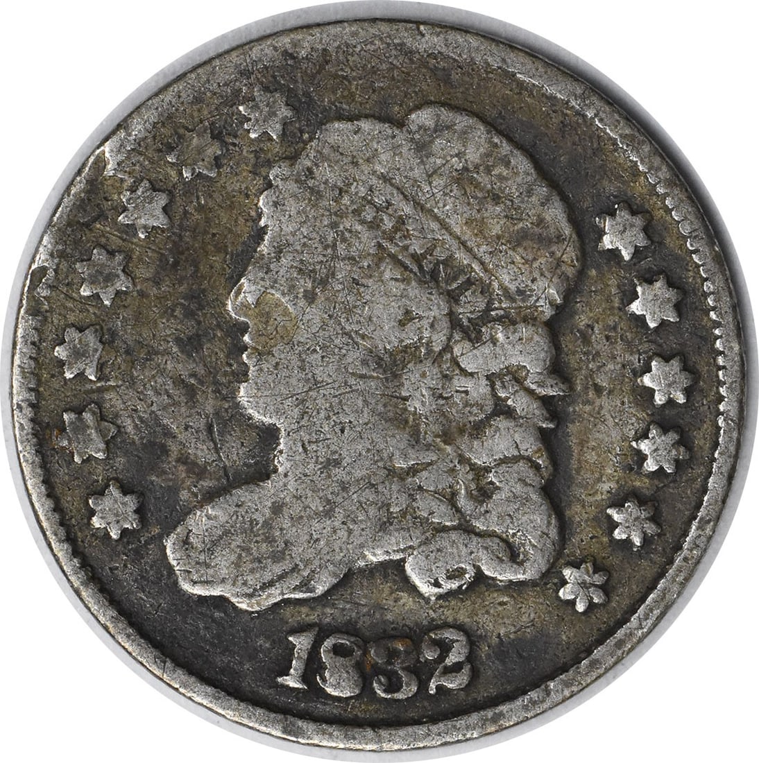 1832 Capped Bust Half Dime Silver Coin Uncertified: 1832 Capped Bust Half Dime Silver Coin Uncertified This 1832 Bust Silver Half Dime features a classic Capped Bust design, created by renowned designer William Kneass. Struck at the Philadelphia Mint, 