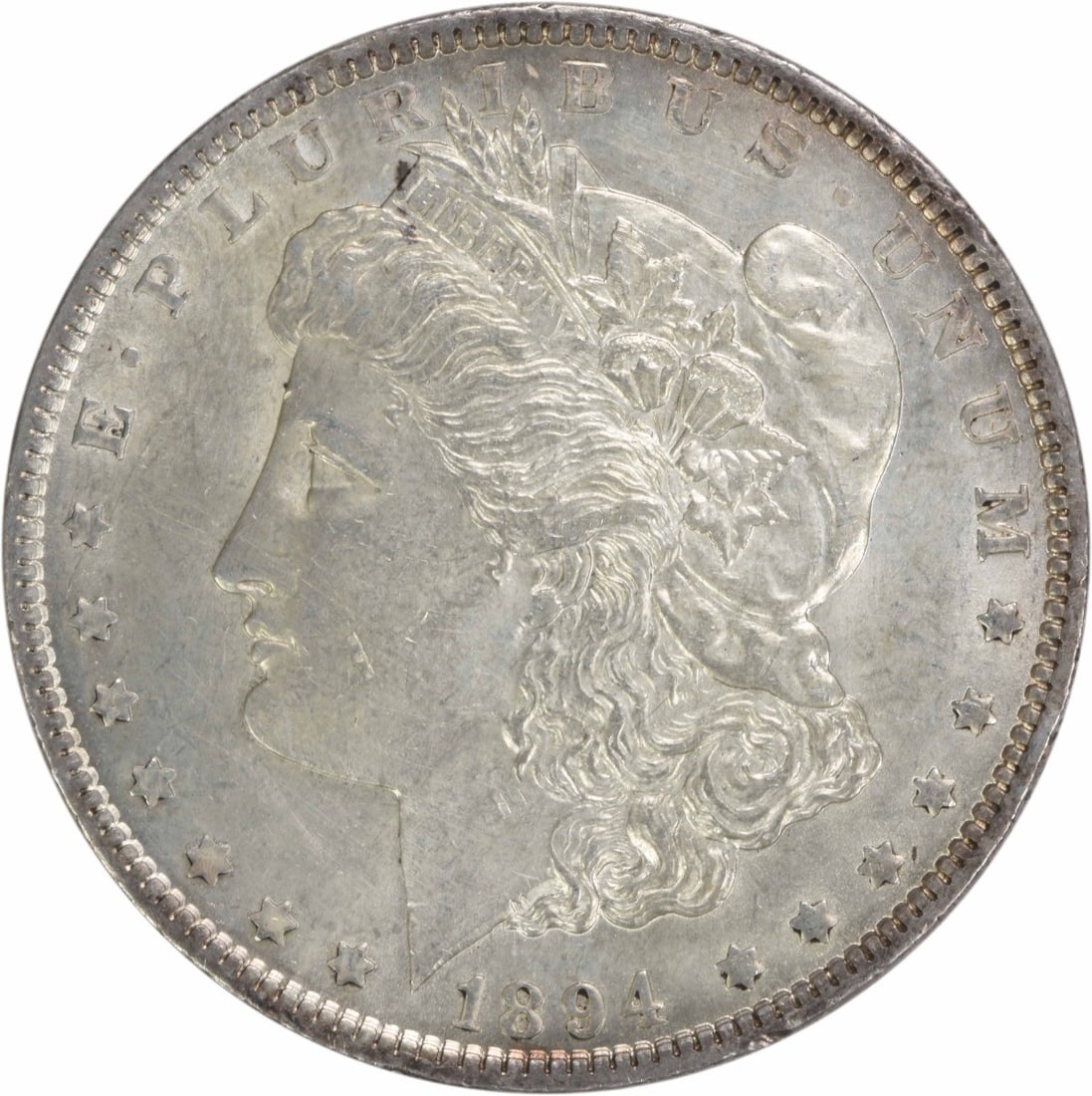 1894 Philadelphia Morgan Dollar AU Uncertified Silver Coin: 1894 Philadelphia Morgan Dollar AU Uncertified Silver Coin This 1894 Morgan Silver Dollar is an attractive example from the Philadelphia Mint, featuring a composition of 90% silver and 10% copper. Des