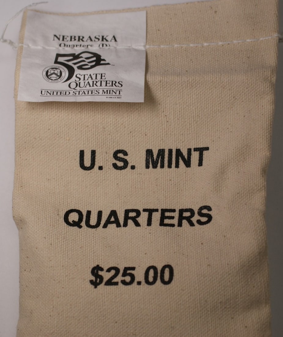 2006-D Nebraska State Quarters $25 Mint Bag 100 Coins: 2006-D Nebraska State Quarters $25 Mint Bag 100 Coins This item is a $25 face value bag containing 100 Nebraska Statehood quarters from 2006, each bearing the Denver Mint mark. The coins are housed in
