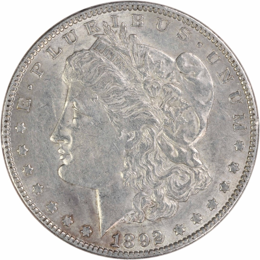 1892 Philadelphia Morgan Dollar AU 90 Percent Silver Uncertified: 1892 Philadelphia Morgan Dollar AU 90 Percent Silver Uncertified This 1892 Morgan Silver Dollar was minted in Philadelphia and features a composition of 90% silver and 10% copper. Designed by George T