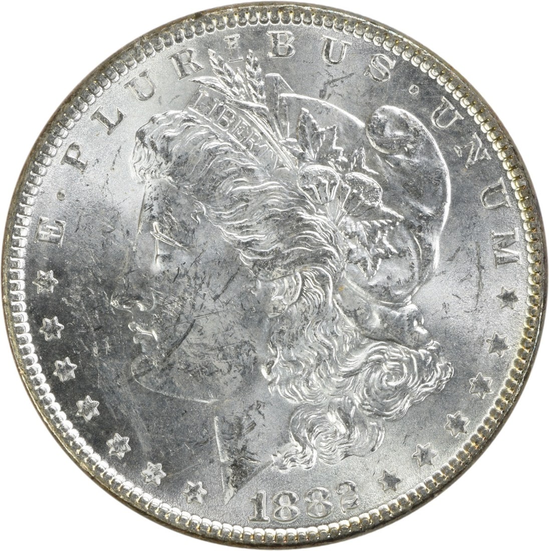 Uncirculated 1882 Silver Dollar Morgan Series Choice BU No Mint Mark: Uncirculated 1882 Silver Dollar Morgan Series Choice BU No Mint Mark This 1882 Morgan Silver Dollar is an uncirculated coin from the United States, featuring a composition of silver. It is a pre-owned