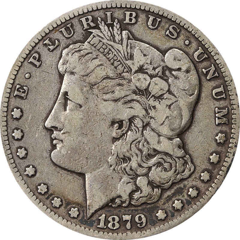 1879 CC Morgan Dollar VF- Silver Coin: 1879 CC Morgan Dollar VF- Silver Coin This 1879-CC Morgan Silver Dollar is a circulated coin featuring nice eye appeal, attractive color, and well-preserved surfaces. Struck in silver with a fineness 