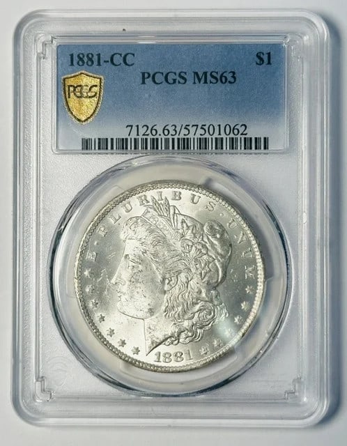 1881 Carson City Morgan Dollar PCGS MS-63 Silver: 1881 Carson City Morgan Dollar PCGS MS-63 Silver This 1881 Morgan Silver Dollar was minted in Carson City and has been graded MS-63 by PCGS. Crafted from silver, this pre-owned coin is a collectible p