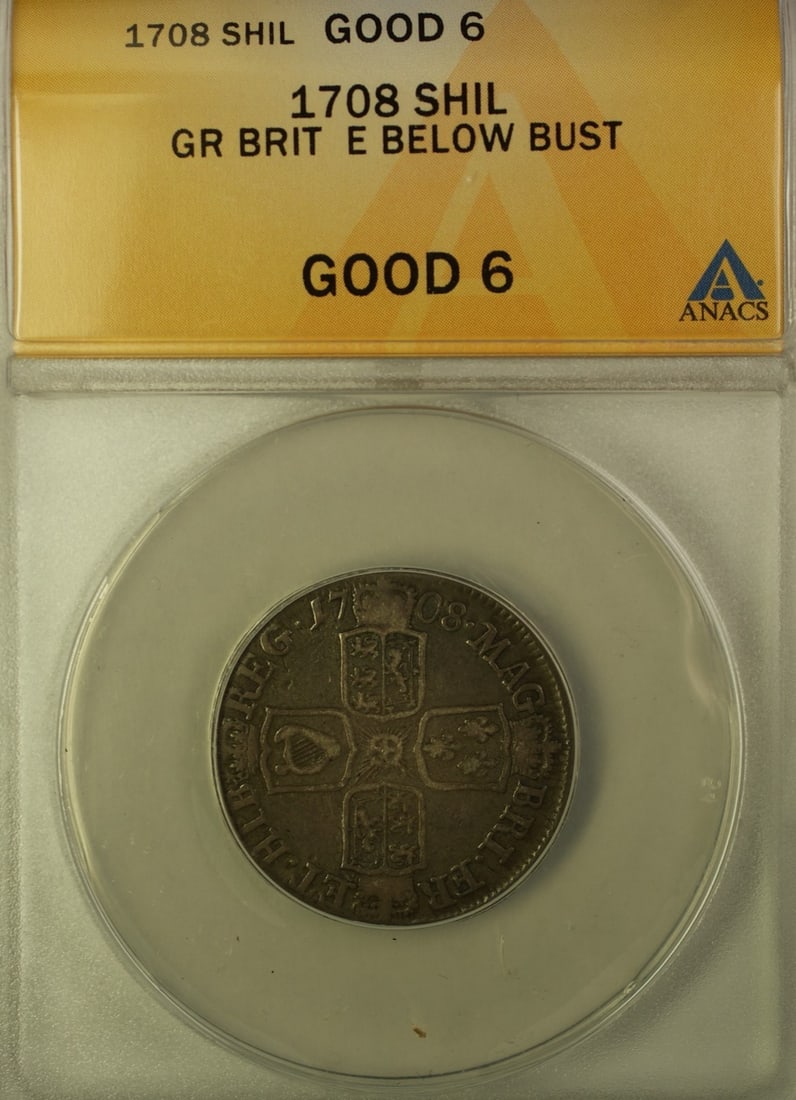 1708 Silver Shilling with E Under Bust ANACS G-6 Certified: 1708 Silver Shilling with E Under Bust ANACS G-6 Certified This 1708 Great Britain shilling features the 'E Below Bust' variety and is composed of silver. The coin is graded G-6 by ANACS and is in cir
