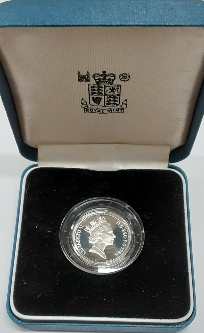 1988 Silver Proof One Pound Coin Crowned Royal Shield With Box and COA: 1988 Silver Proof One Pound Coin Crowned Royal Shield With Box and COA This is a 1988 United Kingdom one pound proof coin featuring the crowned royal shield on the reverse. Composed of 0.925 fine silv