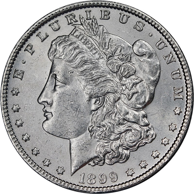 1899 P Morgan Silver Dollar BU+ Uncertified Bright White: 1899 P Morgan Silver Dollar BU+ Uncertified Bright White This 1899-P Morgan Silver Dollar is an uncirculated coin featuring bright white surfaces, strong luster, and a well-defined strike. It is compo