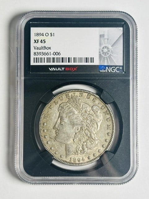 NGC XF45 1894 O Morgan Dollar New Orleans Mint: NGC XF45 1894 O Morgan Dollar New Orleans Mint This 1894 Morgan Silver Dollar was minted in New Orleans and is certified by NGC with a grade of XF 45. Composed of silver, this circulated coin is a not