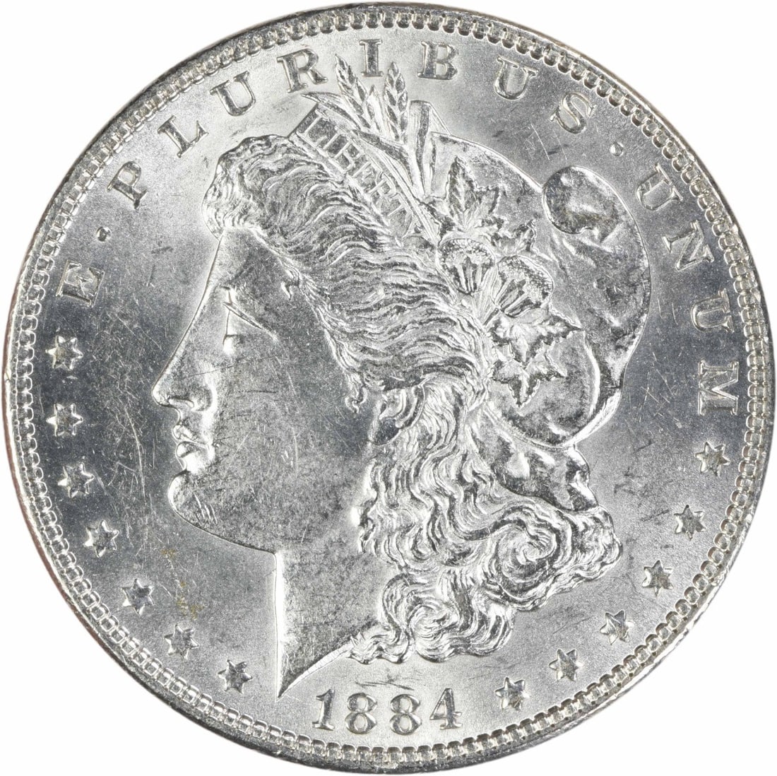 1884 Philadelphia Morgan Dollar 90 Silver AU Uncertified: 1884 Philadelphia Morgan Dollar 90 Silver AU Uncertified This 1884 Morgan Silver Dollar is an attractive circulated coin from the Philadelphia Mint, featuring the iconic design by George T. Morgan. Co