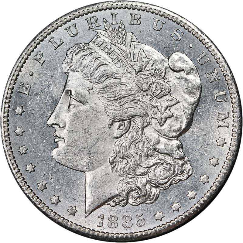 1885-S Morgan Dollar Blast White BU+: 1885-S Morgan Dollar Blast White BU+ This 1885-S Morgan Silver Dollar is an uncirculated coin featuring brilliant luster and a strong strike. The coin displays a blast white appearance with attractive