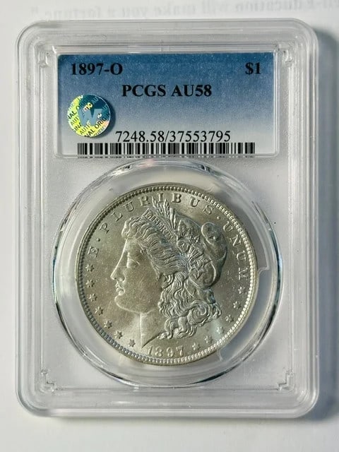 1897 New Orleans Morgan Dollar PCGS AU58 Silver: 1897 New Orleans Morgan Dollar PCGS AU58 Silver This is an 1897 Morgan Silver Dollar certified by PCGS with an AU-58 grade. Minted in New Orleans, this pre-owned coin is composed of silver and has bee