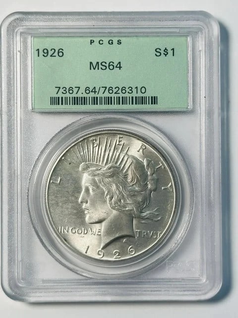 1926 Philadelphia Peace Dollar PCGS MS64 Old Green Holder: 1926 Philadelphia Peace Dollar PCGS MS64 Old Green Holder This 1926 Peace Dollar is graded MS-64 by PCGS and comes in the sought-after Old Green Holder. Minted in Philadelphia, this silver dollar is a