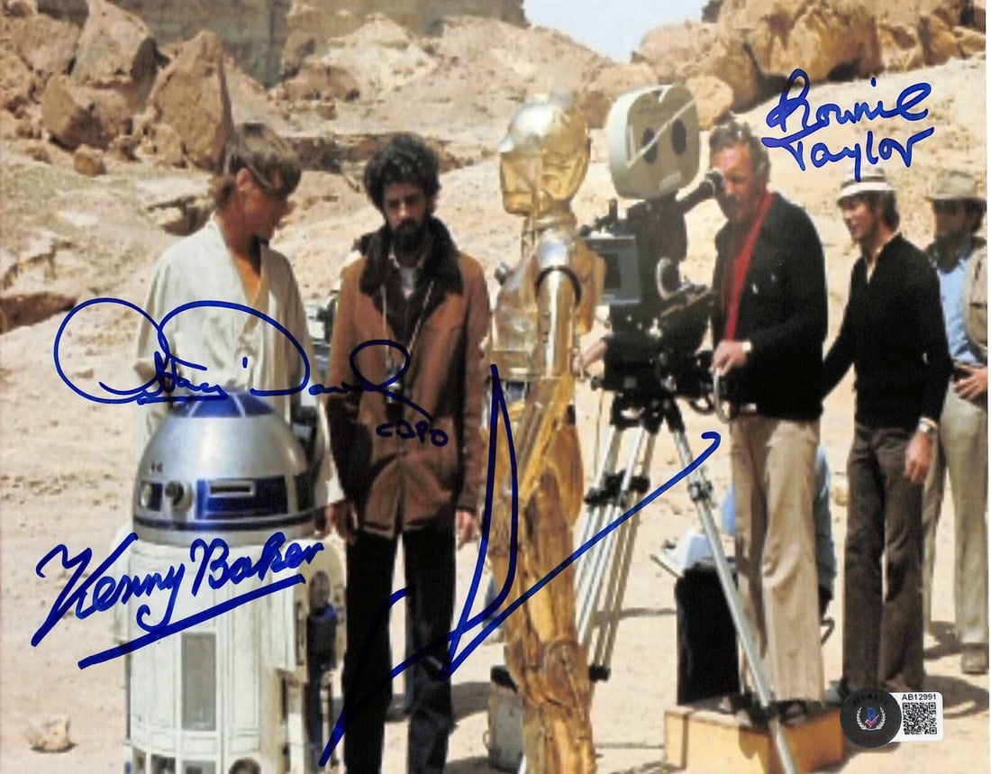 8x10 Photo Signed by George Lucas and Three Star Wars Cast Beckett Authenticated: 8x10 Photo Signed by George Lucas and Three Star Wars Cast Beckett Authenticated This is an original 8x10 color photograph from the filming of Star Wars, featuring a rare behind-the-scenes image from 