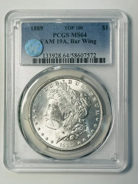 1889 Morgan Silver Dollar PCGS MS64 VAM 19A Mint Error: 1889 Morgan Silver Dollar PCGS MS64 VAM 19A Mint Error This 1889 Morgan Silver Dollar was minted in Philadelphia and is graded MS-64 by PCGS. It features the VAM 19A Bar Wing variety and is noted as a