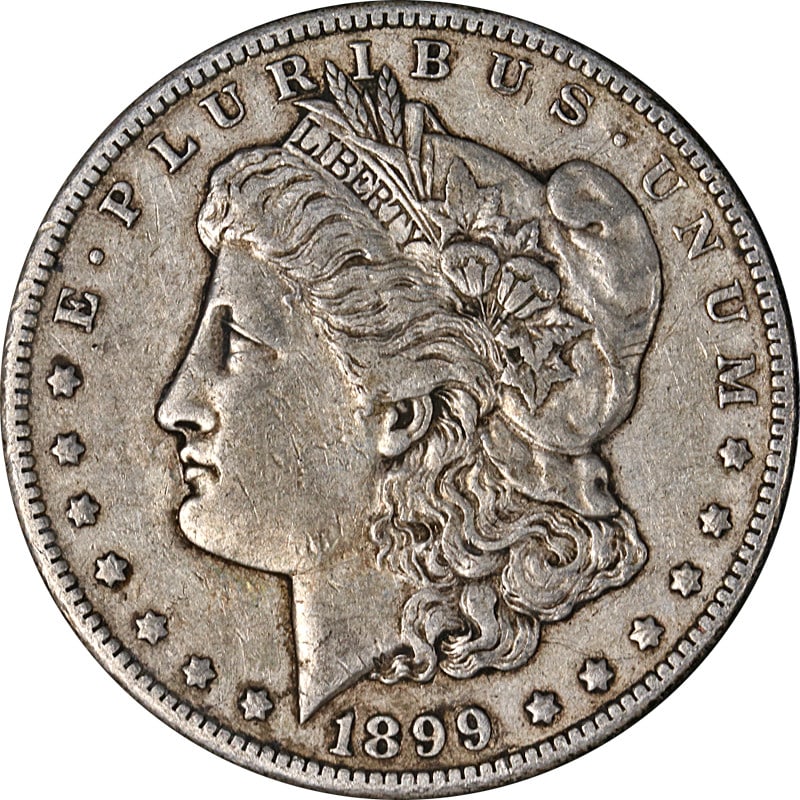 Circulated 1899 O Silver Morgan Dollar from New Orleans Mint: Circulated 1899 O Silver Morgan Dollar from New Orleans Mint This 1899-O Morgan Silver Dollar is a circulated coin with attractive eye appeal and notable surface quality. Selected from a large collect