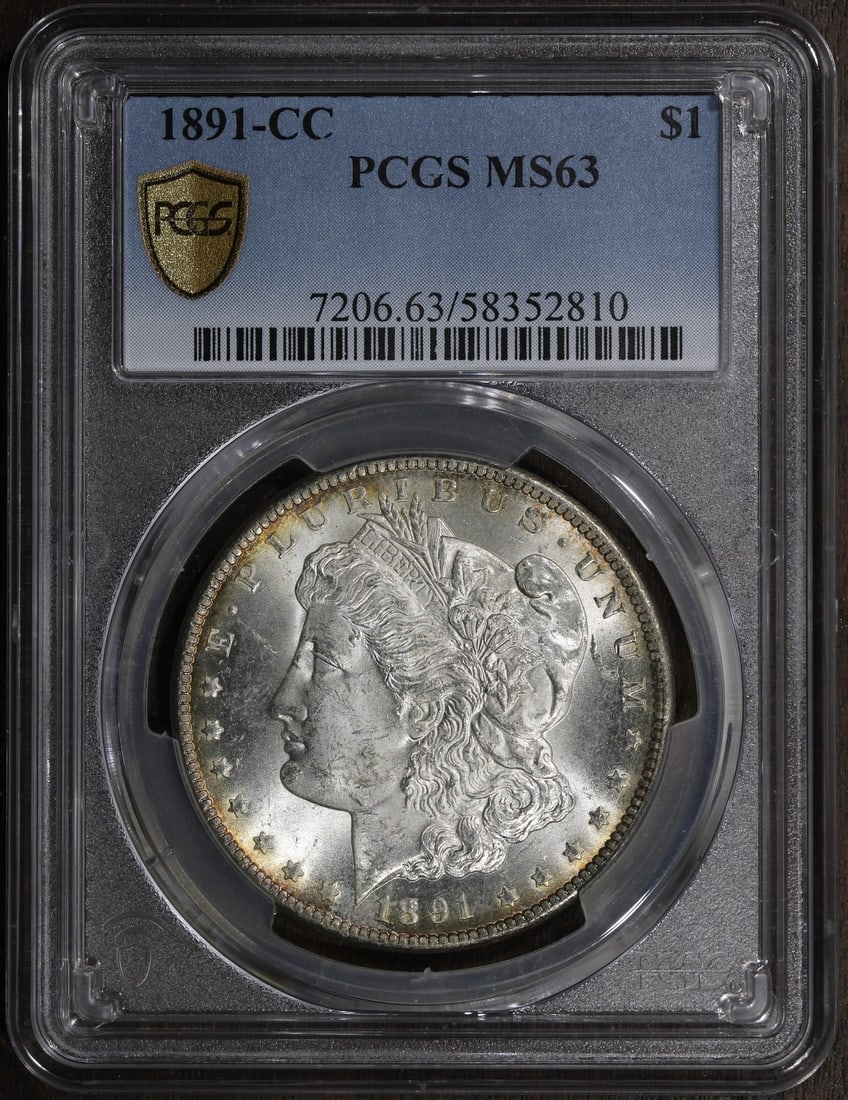 PCGS MS63 1891 CC Morgan Silver Dollar: PCGS MS63 1891 CC Morgan Silver Dollar This is an 1891 Morgan Silver Dollar from the Carson City Mint, graded MS63 by the Professional Coin Grading Service (PCGS). The coin is uncirculated and compose