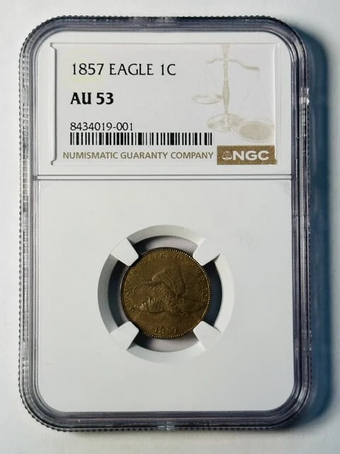 1857 Flying Eagle Cent NGC AU-53 Copper: 1857 Flying Eagle Cent NGC AU-53 Copper This 1857 Flying Eagle small cent is composed of copper and has been graded AU 53 by NGC. It is a pre-owned coin from the United States, offering collectors a w