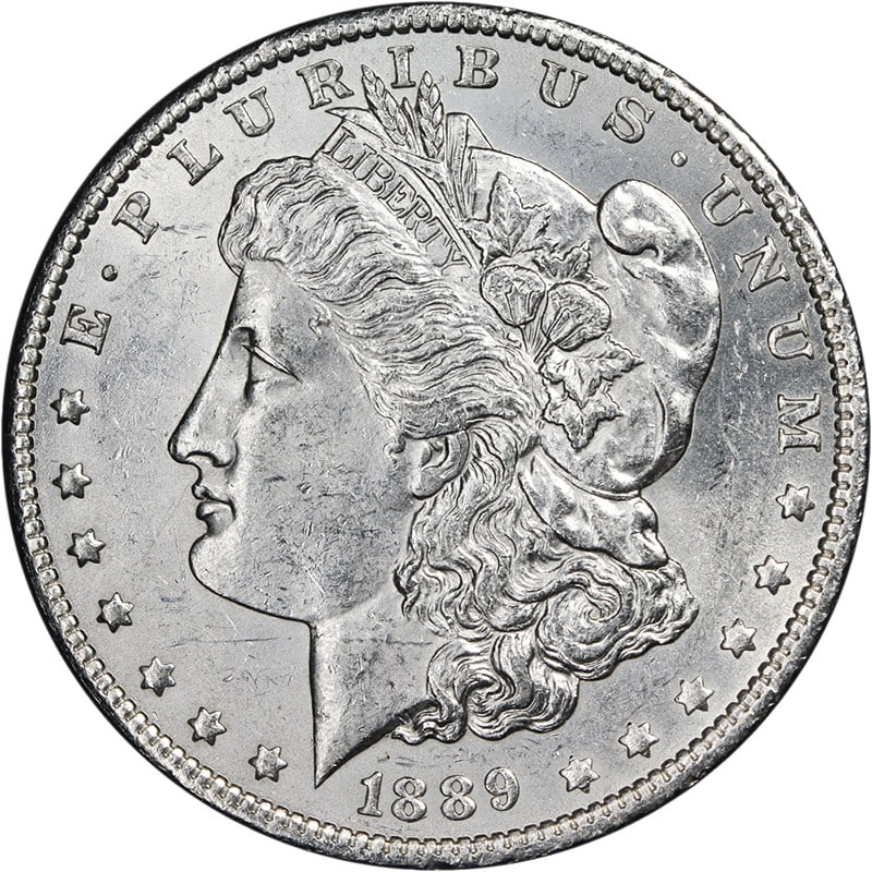 Uncirculated 1889-O Silver Morgan Dollar Brilliant Uncirculated with Strong Luster: Uncirculated 1889-O Silver Morgan Dollar Brilliant Uncirculated with Strong Luster This 1889-O Morgan Silver Dollar is an uncirculated coin featuring bright white luster and a strong strike. It exhibi