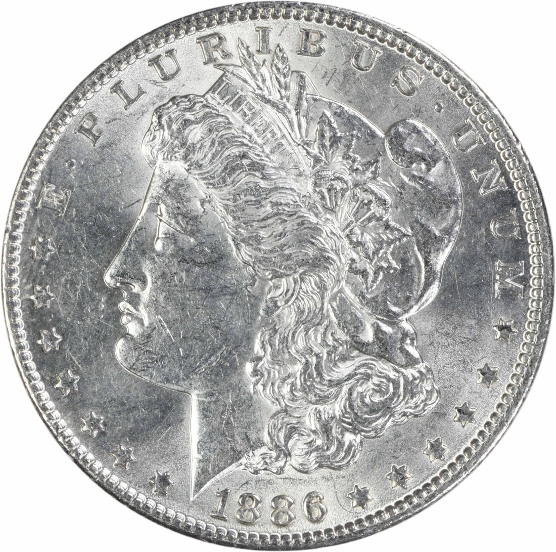 1886 Philadelphia Morgan $1 90 Silver Coin AU Uncertified: 1886 Philadelphia Morgan $1 90 Silver Coin AU Uncertified This is an 1886 Morgan Silver Dollar from the Philadelphia Mint, featuring a composition of 90% silver and 10% copper. Designed by George T. M