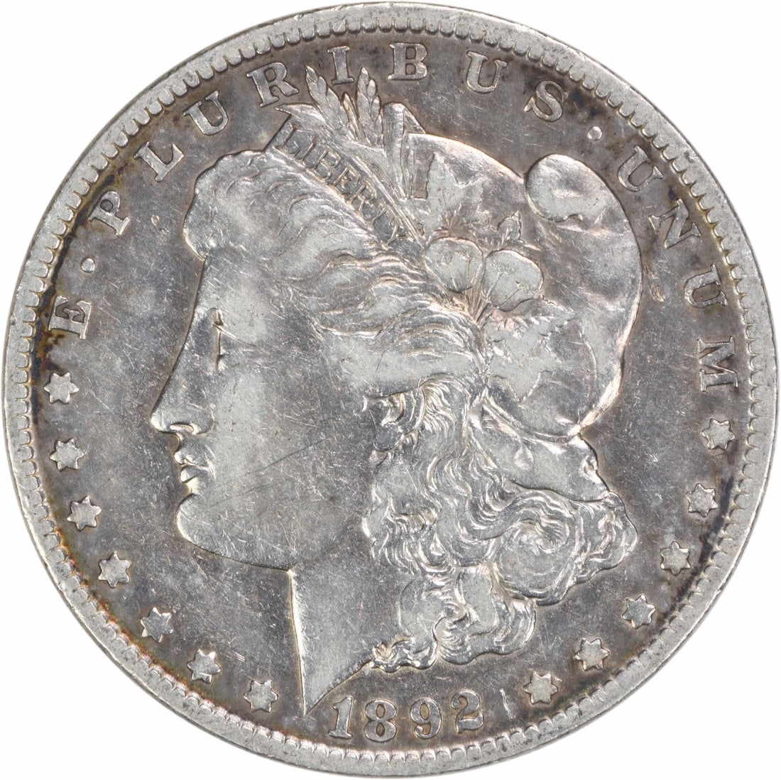 1892 New Orleans Morgan Dollar 90 Percent Silver VF Uncertified: 1892 New Orleans Morgan Dollar 90 Percent Silver VF Uncertified This 1892-O Morgan Silver Dollar is a circulated coin from the New Orleans Mint, featuring the design by George T. Morgan. Composed of 9