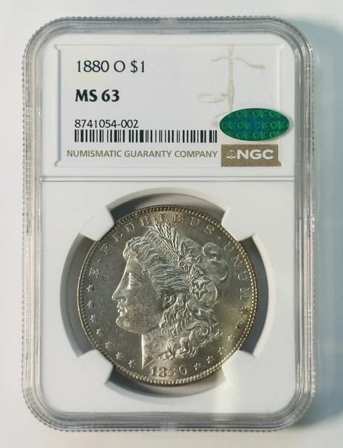 1880-O New Orleans Morgan Dollar NGC MS63 CAC: 1880-O New Orleans Morgan Dollar NGC MS63 CAC This 1880 Morgan Silver Dollar was minted in New Orleans and is graded MS 63 by NGC. It has also been verified by CAC, indicating its quality within the g