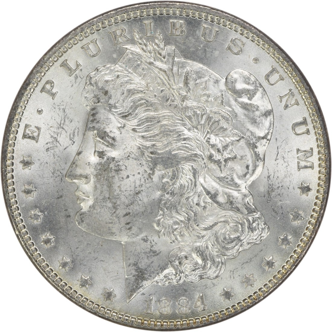 Uncirculated 1884 Silver Dollar Morgan Type Brilliant Uncertified US Coin: Uncirculated 1884 Silver Dollar Morgan Type Brilliant Uncertified US Coin This is an 1884 Morgan Silver Dollar from the United States, featuring a bright uncirculated condition. The coin is uncertifie