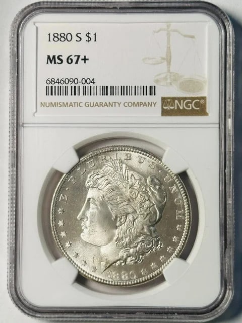 1880-S NGC MS-67 Plus Morgan Silver Dollar: 1880-S NGC MS-67 Plus Morgan Silver Dollar This 1880 Morgan Silver Dollar features a high grade of MS-67+ and has been certified by NGC. The coin displays a flashy white appearance and was struck at t