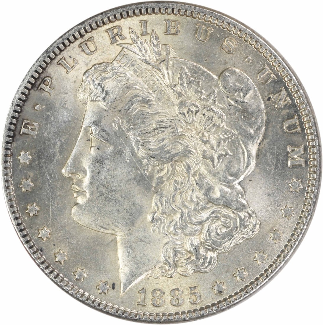 1885 Philadelphia Morgan Dollar AU Uncertified Silver Coin: 1885 Philadelphia Morgan Dollar AU Uncertified Silver Coin This 1885 Morgan Silver Dollar is an attractive example of the classic U.S. coin designed by George T. Morgan. Struck at the Philadelphia Min