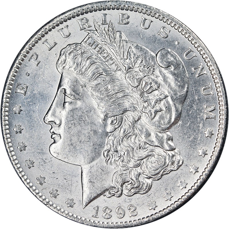 Uncirculated 1892 Philadelphia Morgan Silver Dollar with Attractive Luster: Uncirculated 1892 Philadelphia Morgan Silver Dollar with Attractive Luster This 1892-P Morgan Silver Dollar from the United States features attractive eye appeal, bright white luster, and well-preserv