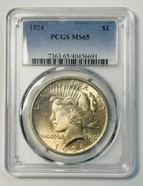 1924 Philadelphia Peace Silver Dollar PCGS MS 65: 1924 Philadelphia Peace Silver Dollar PCGS MS 65 This 1924 Peace Dollar features a silver composition and has been graded MS-65 by PCGS. Minted in Philadelphia, this pre-owned coin is a collectible pi