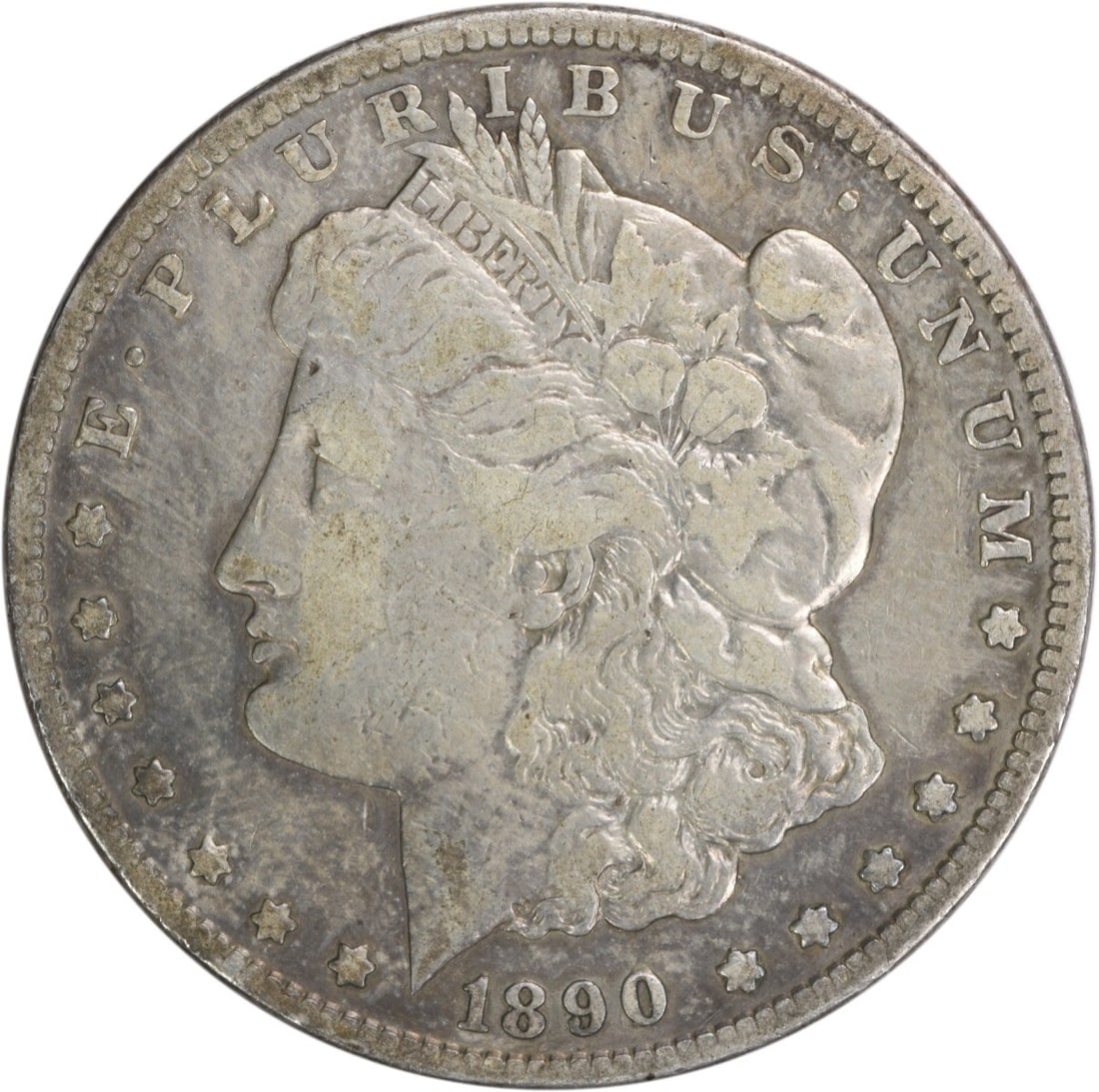 1890-CC Morgan Silver Dollar VF Uncertified 90% Silver Coin: 1890-CC Morgan Silver Dollar VF Uncertified 90% Silver Coin This 1890-CC Morgan Silver Dollar is a captivating piece of numismatic history. Struck in Carson City, this coin features the iconic design 