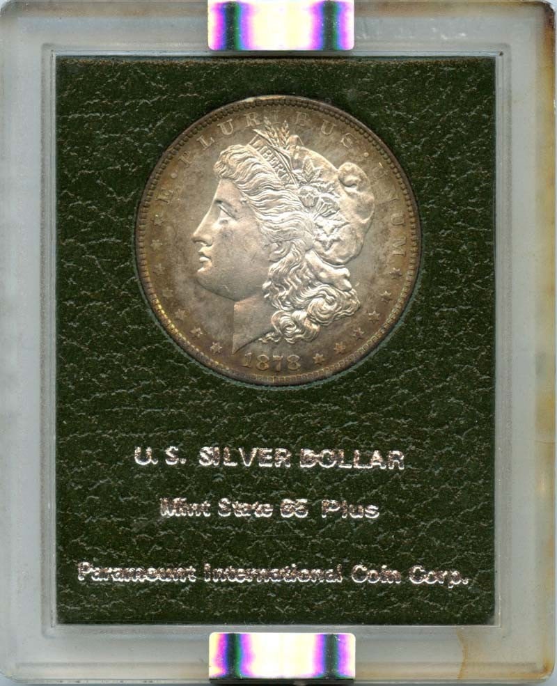 1878 Morgan Dollar NGC MS65 Uncirculated Dark Green Holder: 1878 Morgan Dollar NGC MS65 Uncirculated Dark Green Holder This stunning 1878 Morgan Dollar, graded MS65 by NGC, is an exceptional piece of numismatic history. Minted in Philadelphia, this uncirculate