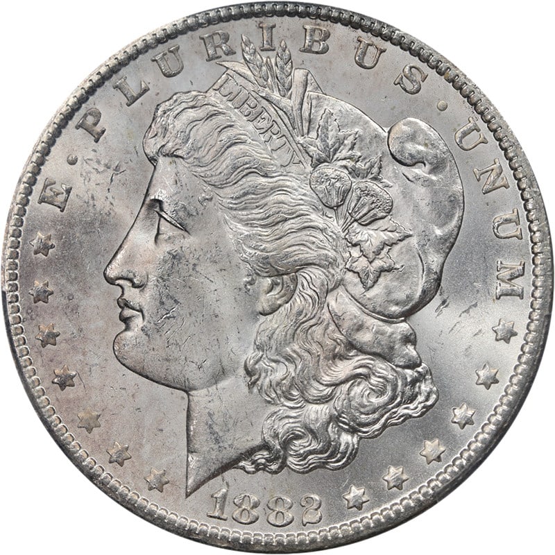 PCGS MS64 1882-CC Morgan Dollar Blast White Strong Strike: PCGS MS64 1882-CC Morgan Dollar Blast White Strong Strike This 1882-CC Morgan Silver Dollar is graded MS64 by PCGS and is uncirculated. It features strong strike details, excellent luster, and a brill