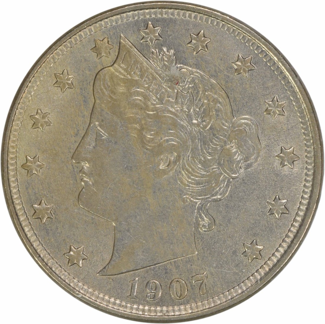 1907 Liberty Nickel AU Uncertified 5C Coin by Charles E Barber: 1907 Liberty Nickel AU Uncertified 5C Coin by Charles E Barber This 1907 Liberty Nickel is a beautiful representation of early 20th-century American coinage. Struck at the Philadelphia Mint, this circ