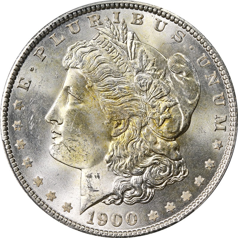 PCGS MS64 1900 P Morgan Dollar Yellow Toning: PCGS MS64 1900 P Morgan Dollar Yellow Toning This 1900-P Morgan Silver Dollar is graded MS64 by PCGS and features distinctive yellow toning at the center of the coin. It is composed of silver with a f