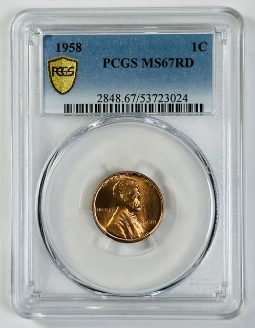 PCGS MS-67 RD 1958 Philadelphia Lincoln Cent: PCGS MS-67 RD 1958 Philadelphia Lincoln Cent This 1958 Lincoln Small Cent is composed of copper and was minted in Philadelphia. Graded MS 67 Red by PCGS, this coin is in pre-owned condition and repres
