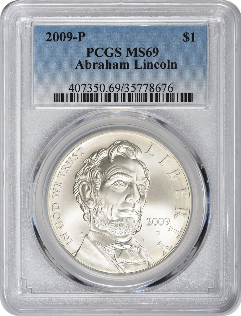 PCGS MS69 2009-P Lincoln Silver Commemorative Dollar: PCGS MS69 2009-P Lincoln Silver Commemorative Dollar This 2009-P Abraham Lincoln Silver Commemorative Dollar is graded MS69 by PCGS, indicating a nearly flawless mint state condition. Struck at the Ph