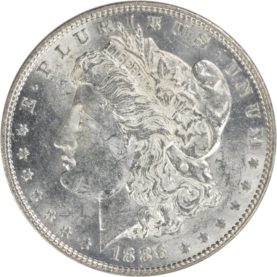 1886 Silver Morgan Dollar Brilliant Uncirculated Uncertified No Mint Mark: 1886 Silver Morgan Dollar Brilliant Uncirculated Uncertified No Mint Mark This is an uncirculated 1886 Morgan Silver Dollar from the United States. The coin features no mint mark and is composed of si