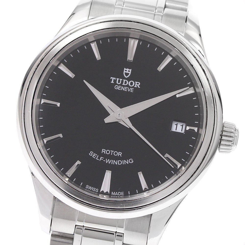 TUDOR Style Date Automatic Unisex Wristwatch: TUDOR Style Date Automatic Unisex Wristwatch This is a pre-owned TUDOR Style Date Automatic wristwatch designed for unisex wear. Made in Switzerland, this timepiece combines classic style with reliabl
