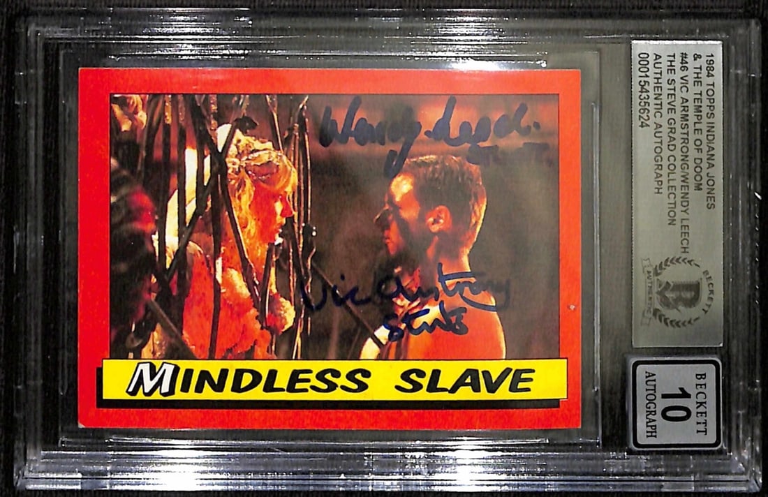 1984 Topps Indiana Jones #46 Signed Card by Vic Armstrong and Wendy Leech BAS Auto 10: 1984 Topps Indiana Jones #46 Signed Card by Vic Armstrong and Wendy Leech BAS Auto 10 This is a signed 1984 Topps Indiana Jones trading card featuring the character Indiana Jones and his stunts. The c