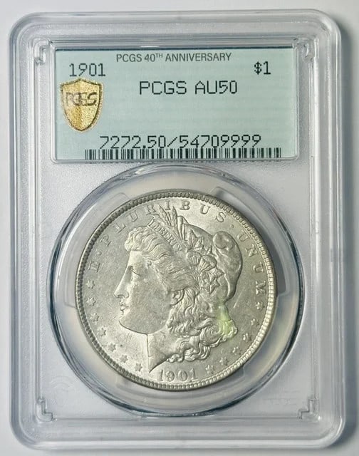 1901 Morgan Dollar PCGS AU-50 Philadelphia Silver: 1901 Morgan Dollar PCGS AU-50 Philadelphia Silver This 1901 Morgan Silver Dollar was minted in Philadelphia and is graded AU-50 by PCGS. Made of silver, it is a pre-owned coin with a certification num