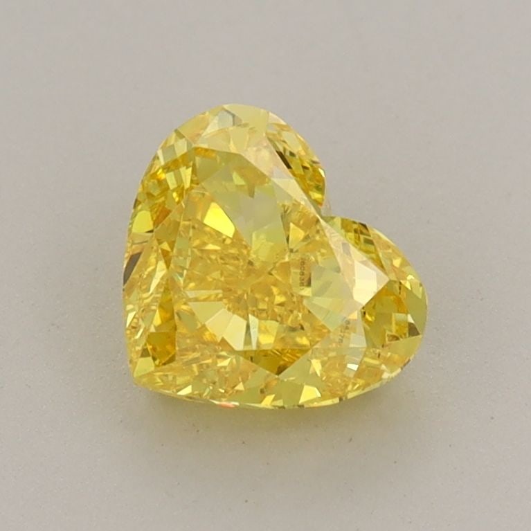 Loose Diamond - HEART 1.03ct Fancy Vivid Yellow VS2: Loose Diamond - HEART 1.03ct Fancy Vivid Yellow VS2 Source: This is a real non-mined Diamond that has been grown in a lab Shape: HEART Carats: 1.03 Color: Fancy Vivid Yellow Certification: IGI Additio