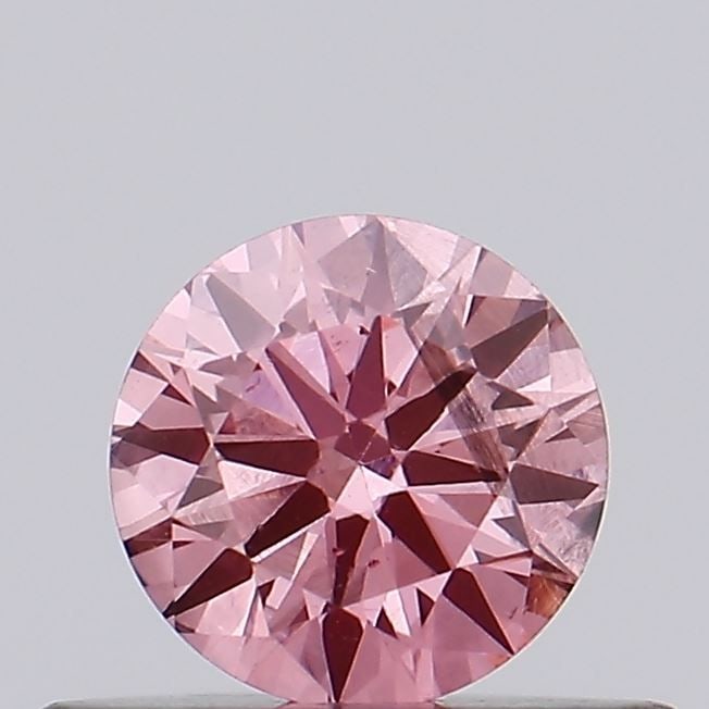 Loose Diamond - ROUND 0.35ct Fancy Vivid Pink SI2: Loose Diamond - ROUND 0.35ct Fancy Vivid Pink SI2 Source: This is a real non-mined Diamond that has been grown in a lab Shape: ROUND Carats: 0.35 Color: Fancy Vivid Pink Certification: IGI Video: