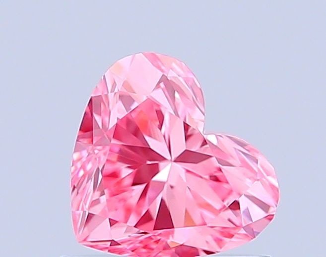 Loose Diamond - HEART 0.71ct Fancy Vivid Pink VVS1: Loose Diamond - HEART 0.71ct Fancy Vivid Pink VVS1 Source: This is a real non-mined Diamond that has been grown in a lab Shape: HEART Carats: 0.71 Color: Fancy Vivid Pink Certification: IGI Video: