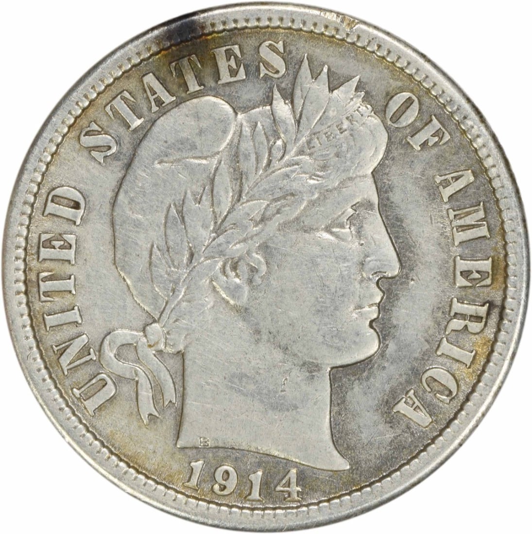 1914 Barber Silver Dime 90% Silver AU Uncertified: 1914 Barber Silver Dime 90% Silver AU Uncertified This 1914 Barber Silver Dime is a remarkable piece of American numismatic history. Featuring the iconic design by Charles E. Barber, this coin was min
