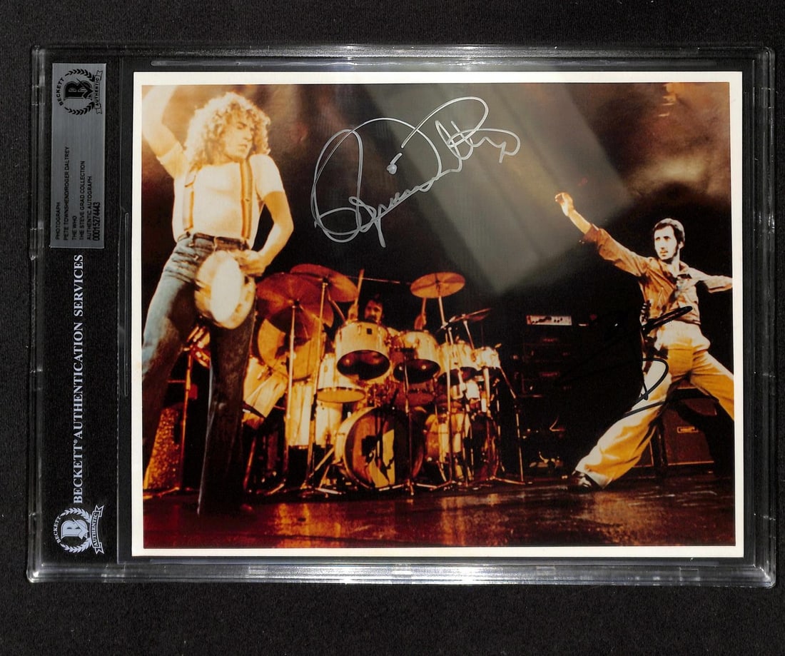 Beckett Authenticated 8x10 The Who Photo Signed by Townshend and Daltrey: Beckett Authenticated 8x10 The Who Photo Signed by Townshend and Daltrey This 8x10 photo features a vivid concert image of Pete Townshend and Roger Daltrey from The Who, hand-signed by both musicians.