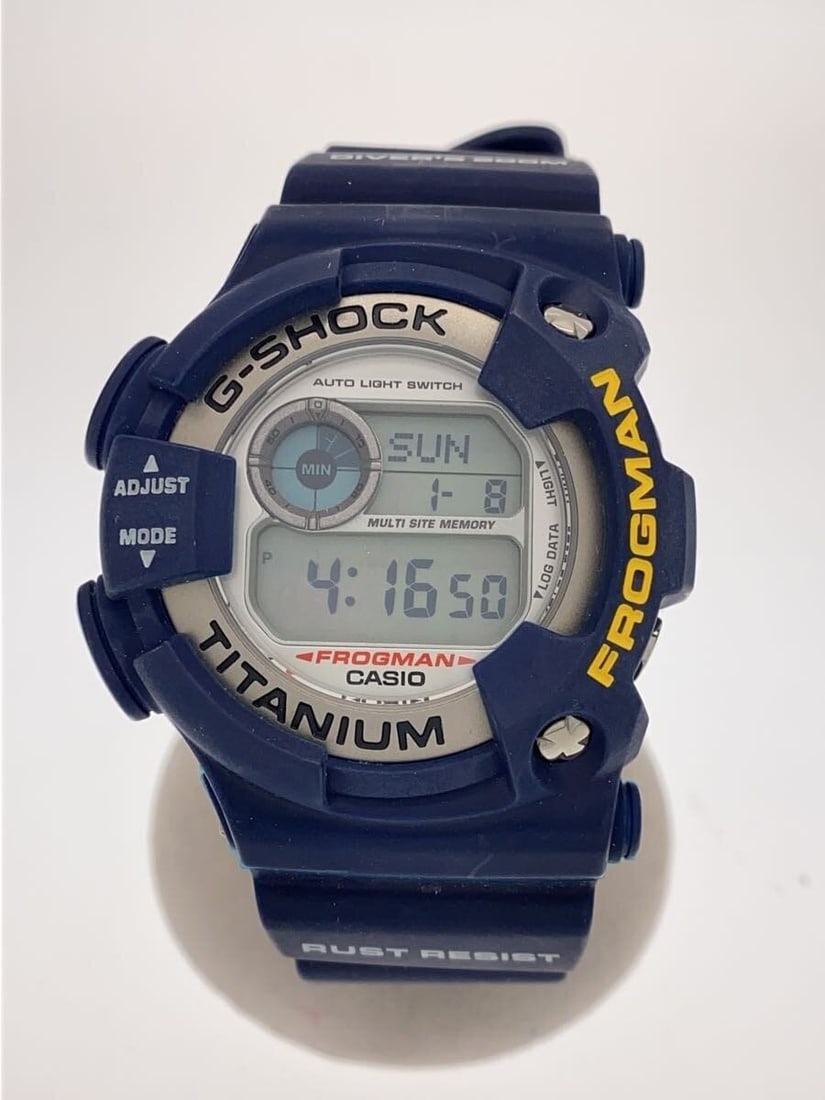 Casio G Shock DW 9900NK 2JR Navy Men's Wristwatch: Casio G Shock DW 9900NK 2JR Navy Men's Wristwatch This CASIO G-SHOCK DW-9900NK-2JR men's wristwatch features a navy color and is crafted in Japan. The watch shows slight signs of wear but remains in g